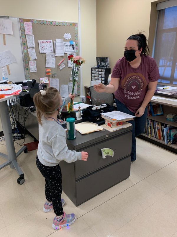 Students deliver kindness cards on Valentine's Day.