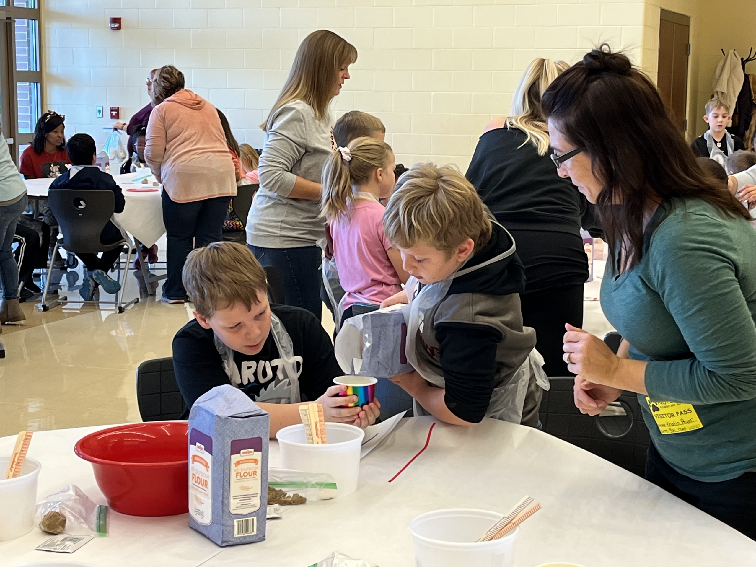 Our third graders were busy making bread to enjoy with their families. We had many volunteers who came to add a helping hand.