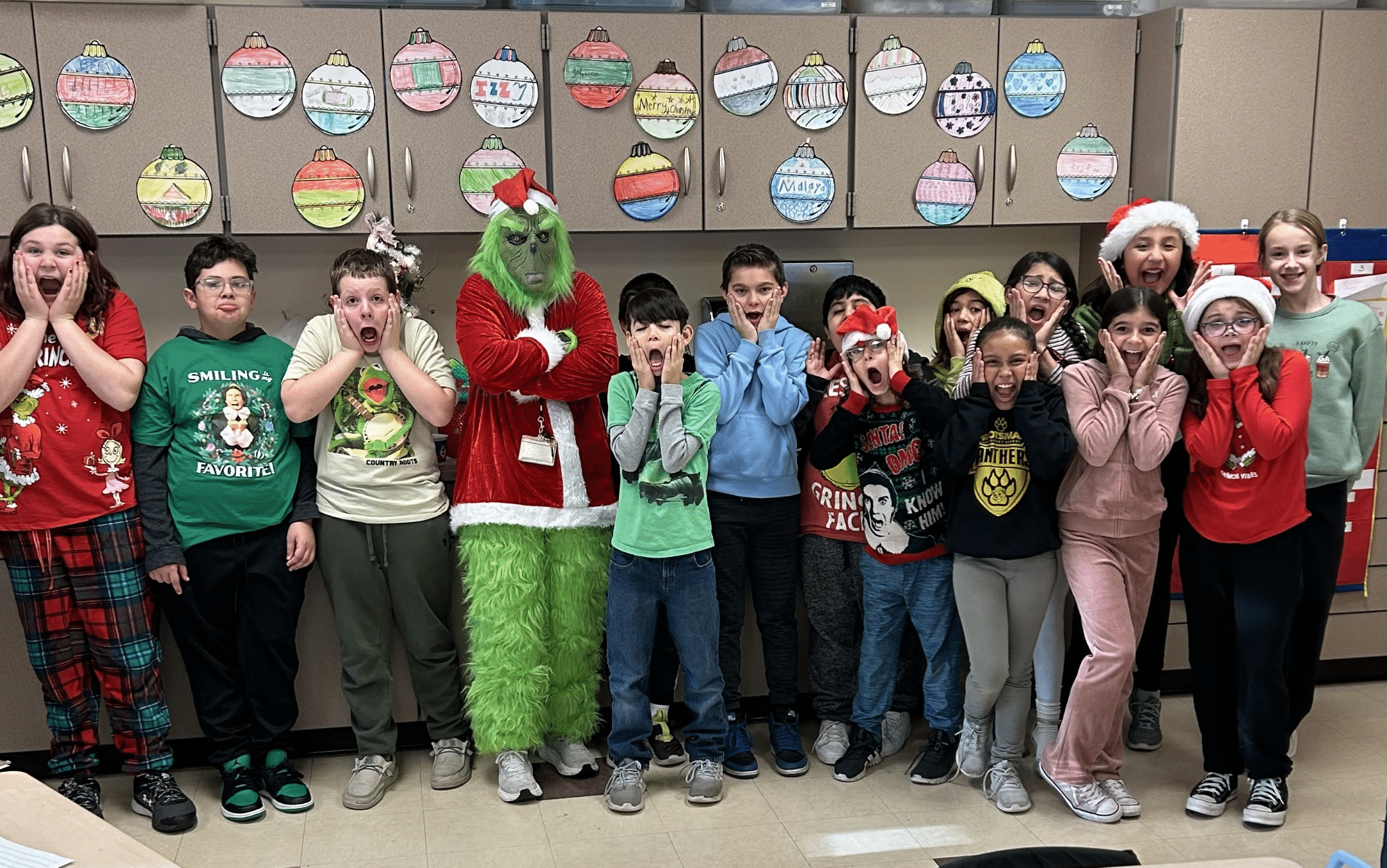 Mrs Ramirez (or shall I say Mr. Grinch) conducted class in the fourth grade hallway last Friday.